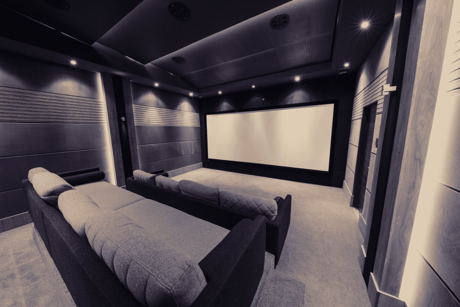 Front-on view of a calibrated home cinema screen and seating